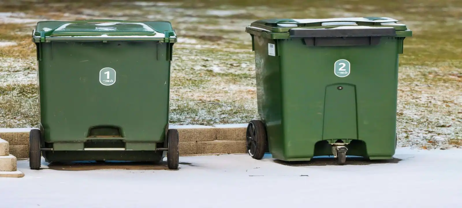 Two 6m3 green skip bins placed on open land for skip bin hire Launceston area