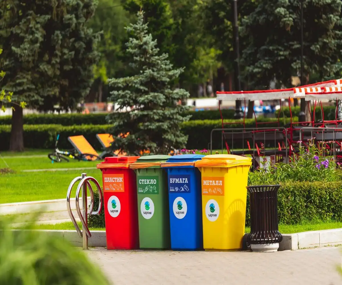 Different coloured skip bins placed in a park as part of skip bin hire launceston area services
