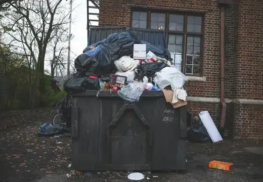 Commercial waste piled on a small skip bin, where the bin is clearly too small, highlighting the need for larger skip bins launceston solutions