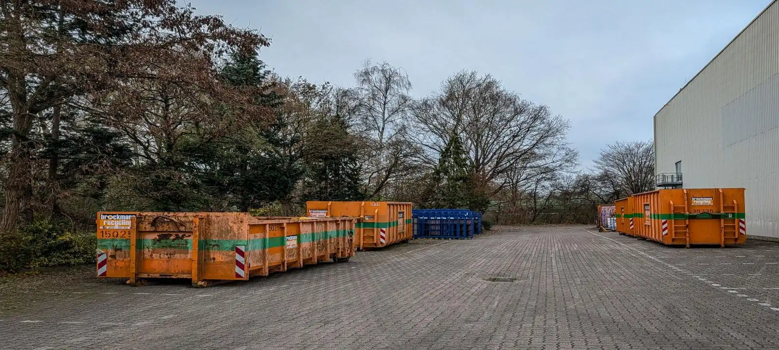 Orange commercial skip bin placed on open land for skip bin hire launceston tasmania projects